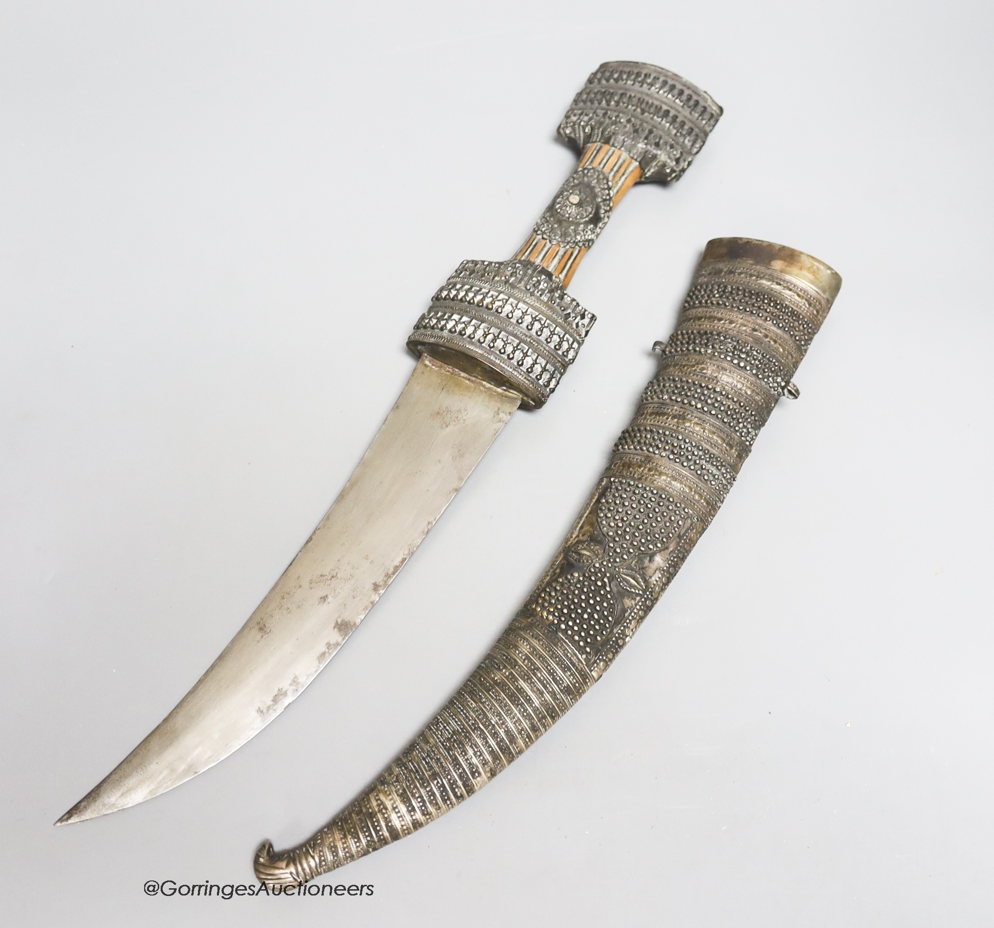 A Middle Eastern silver mounted dagger, length 51cm